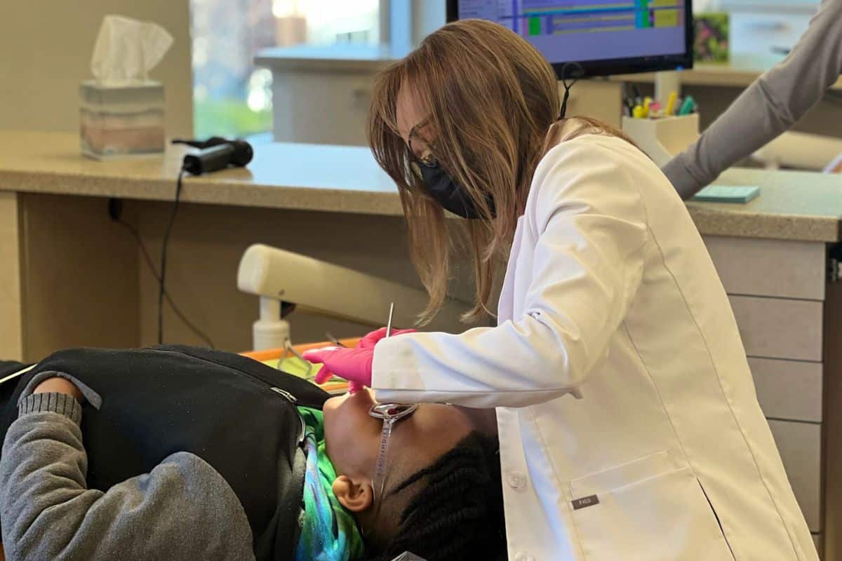 Dr. Minera treating a young patient during an orthodontic appointment at minera orthodontics in warrenton, va.