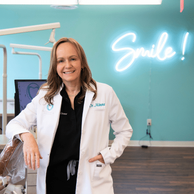 Dr. Sole minera posing for a photo at minera orthodontics, representing personalized orthodontic care